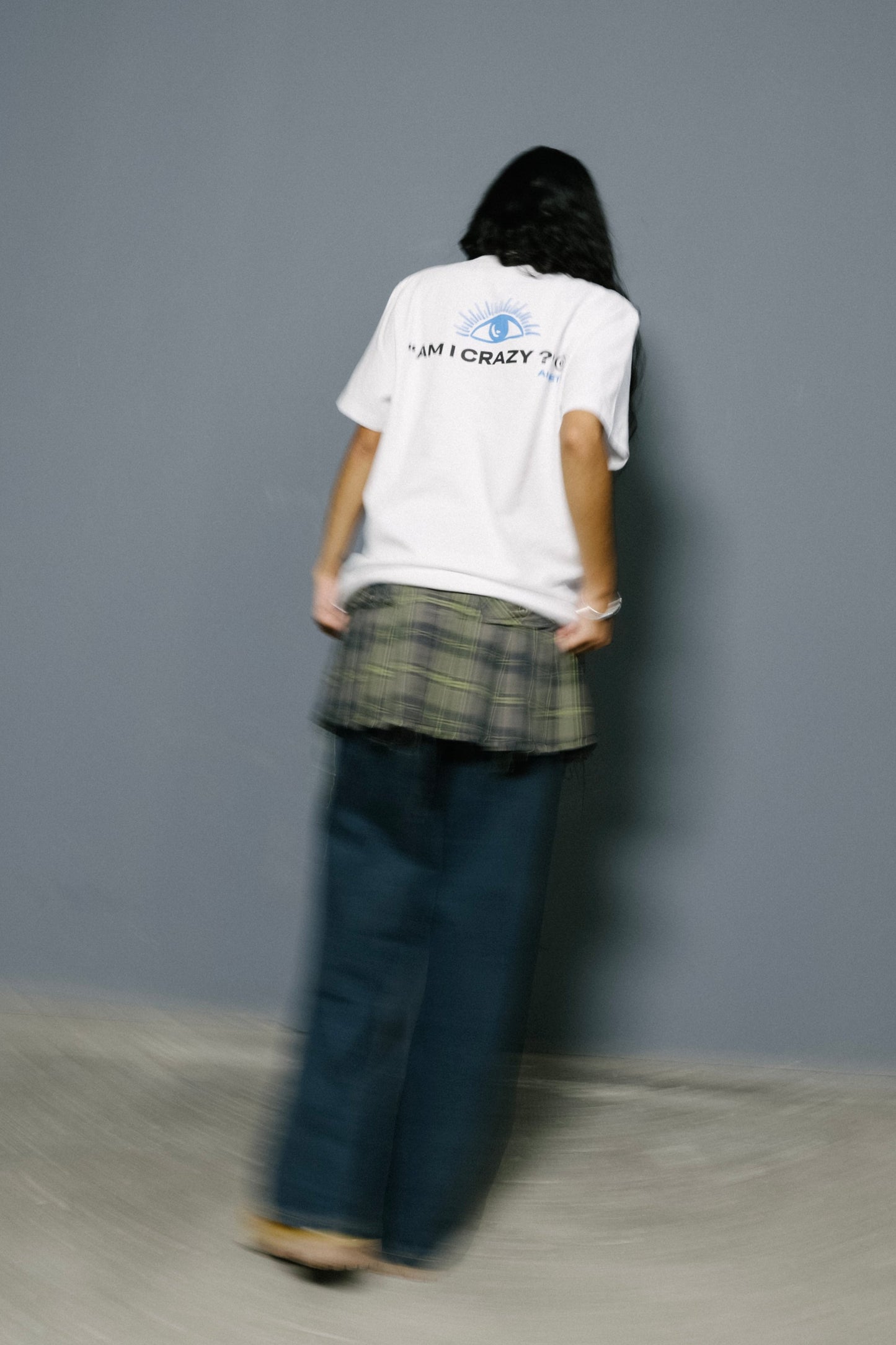 A model wearing a 11:11 L.U.C.K. t-shirt