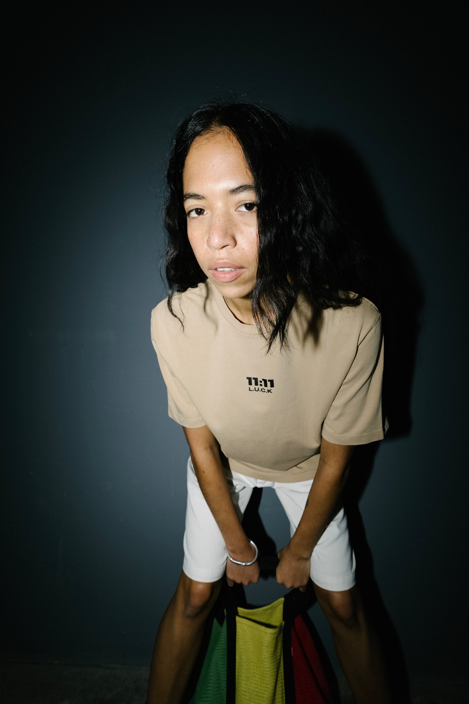 A model wearing a 11:11 L.U.C.K. SIMPLE BUT NOT SIMPLE UNISEX T‑SHIRT